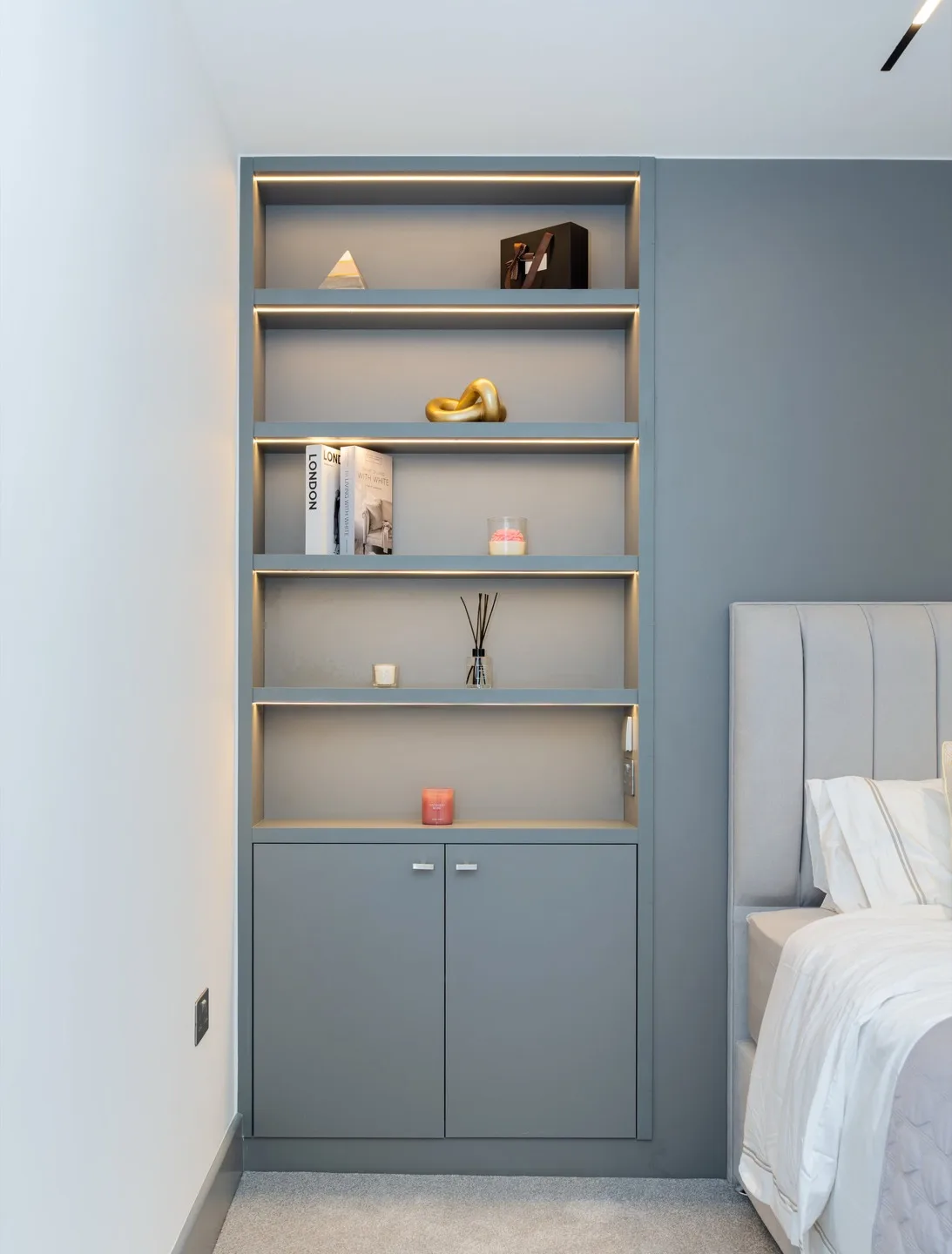 Bespoke headboard integrated shelving brass edge bookshelf — Kensington