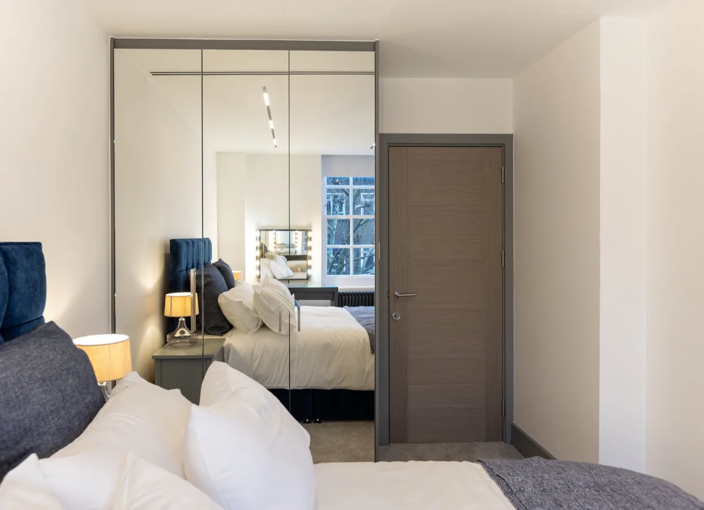 Bespoke fitted wardrobe mirrored doors wide angle — Kensington