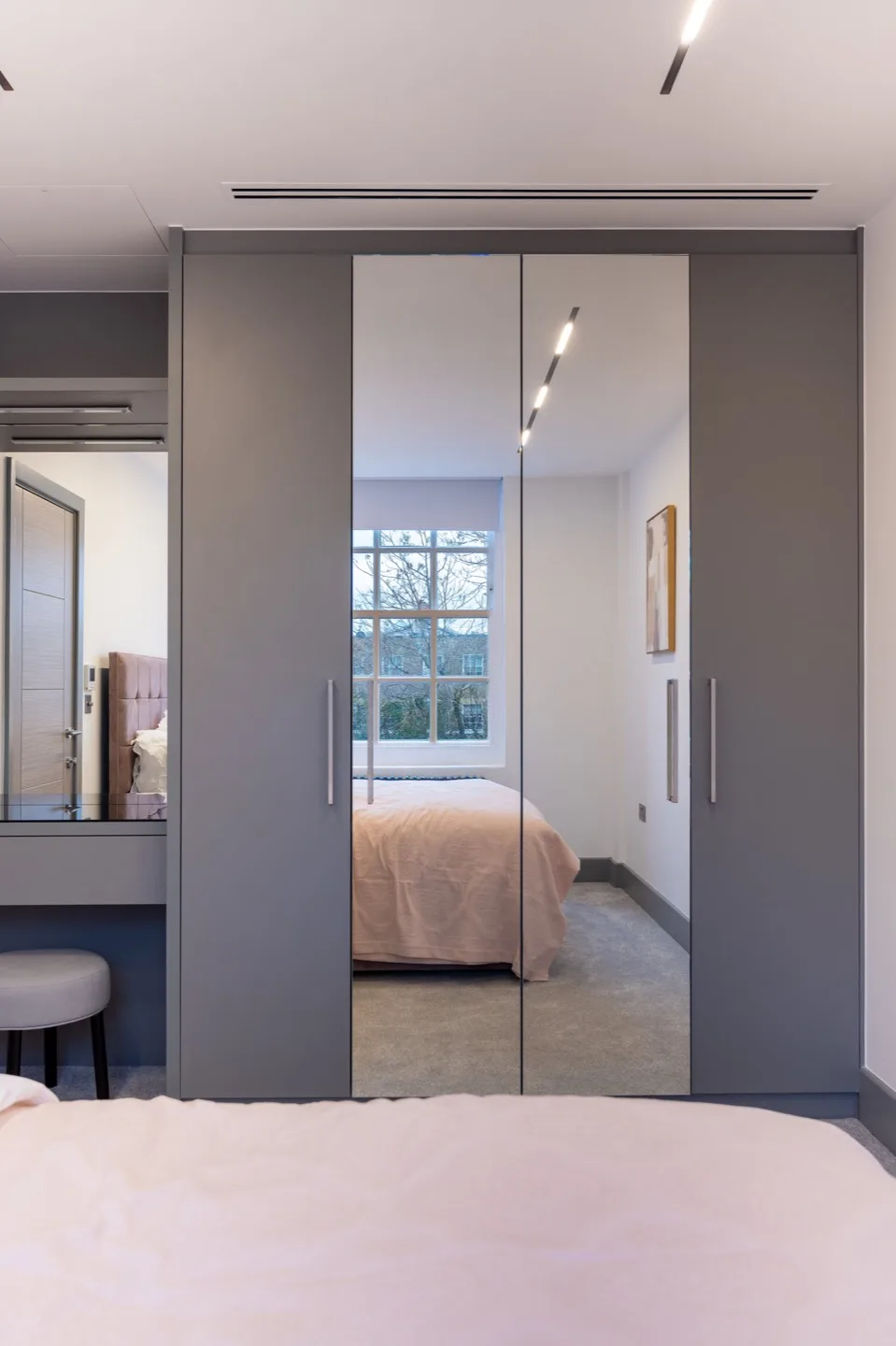Bespoke wardrobe built desk mirrored doors closed — Kensington