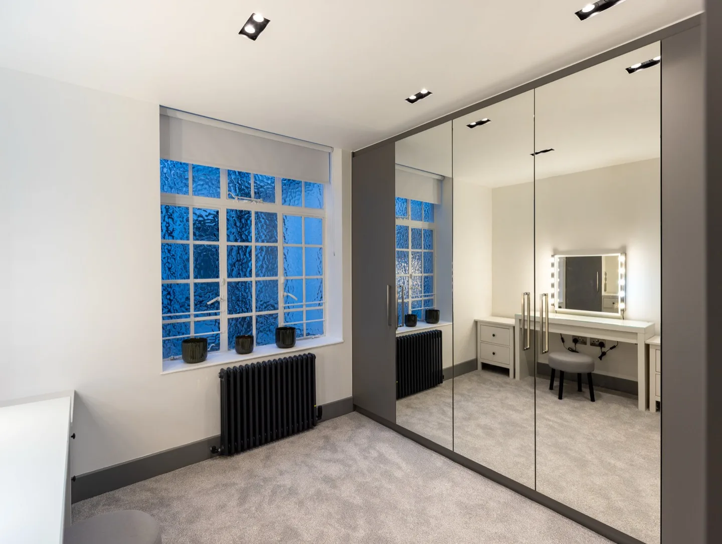 Walk wardrobe mirrored doors window view — Kensington