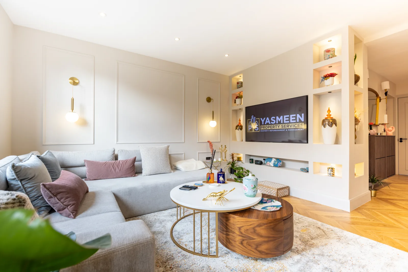 Living room with a bespoke media wall, floating shelves and feature lighting