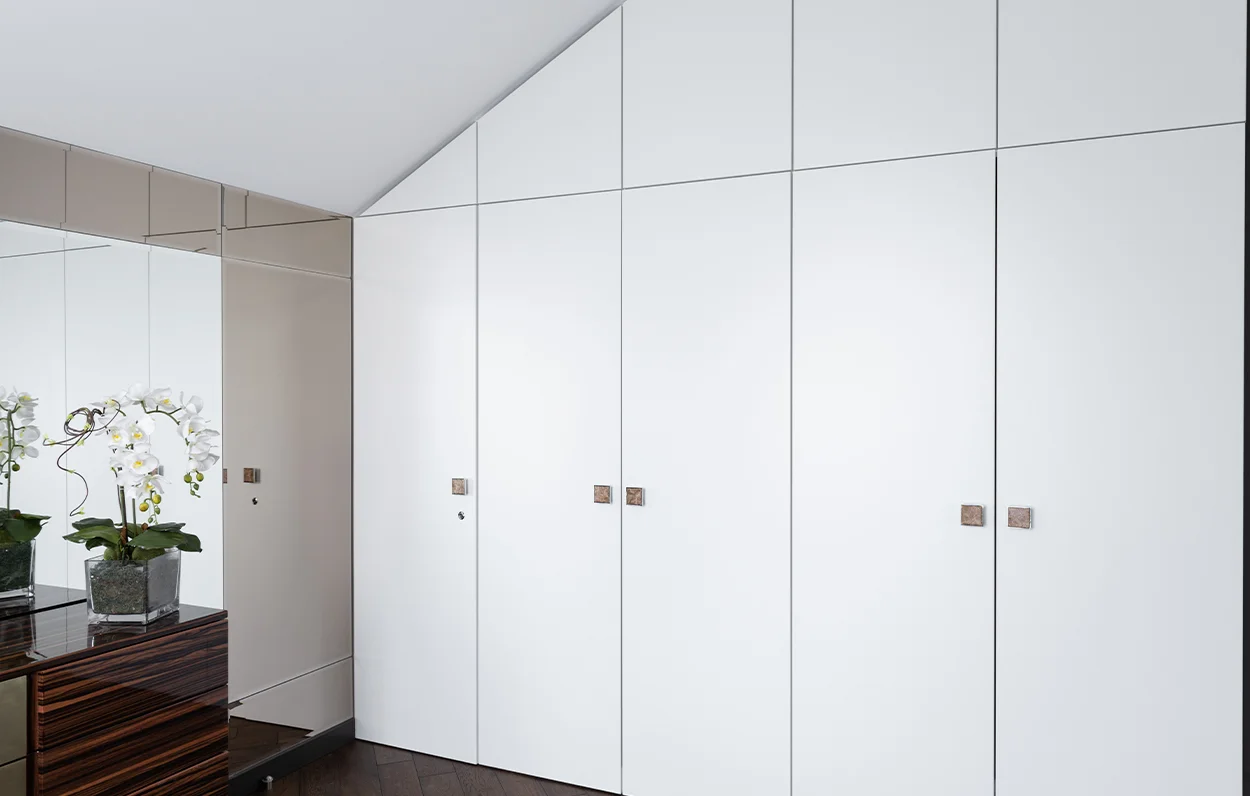 white wardrobe built in wall.