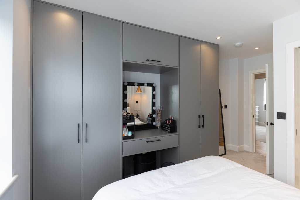 built in wardrobe with makeup desk.